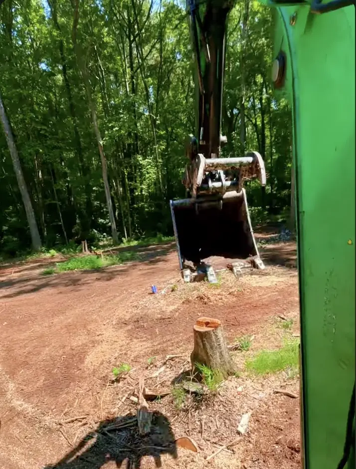 Excavating tree stumps with machinery in Hampton VA